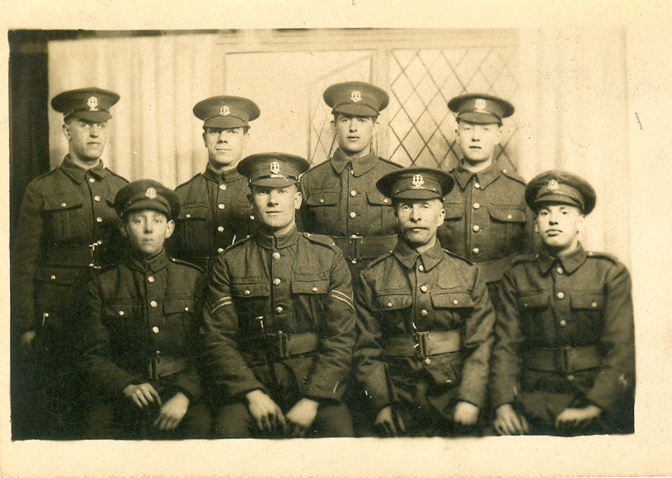 Group photograph of eight soldiers including Ronald Rootham